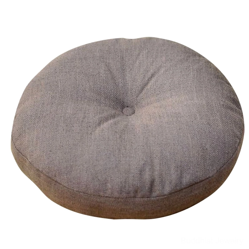 Dark gray linen lotus meditation seat cushion with central button tufted design, white background close-up