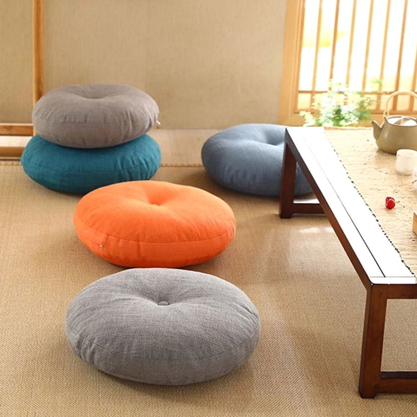 Japanese tea room with gray, blue, orange and teal lotus meditation floor cushions arranged