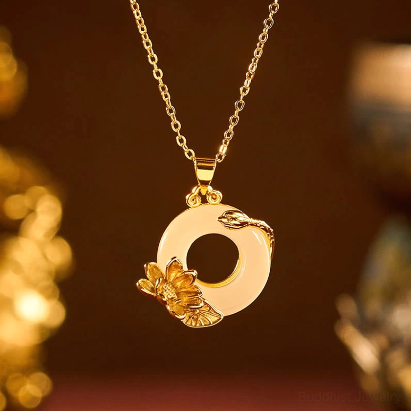 Lotus peace buckle necklace pendant with warm golden lighting, detailed lotus and vine decorations, smooth polished finish