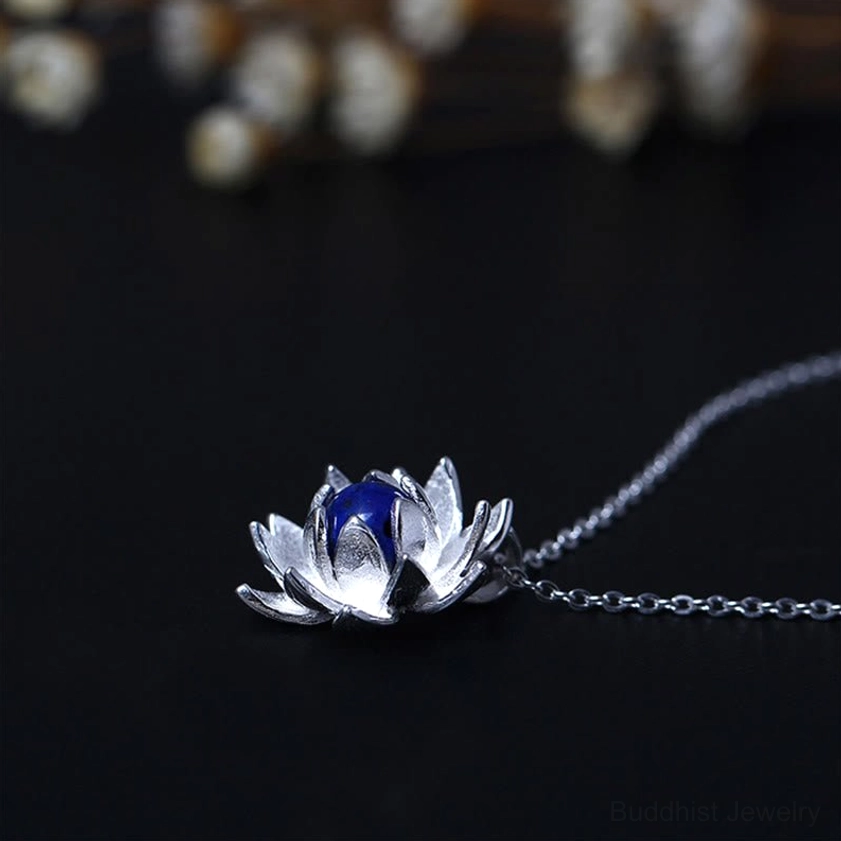 Sterling silver lotus flower necklace with lapis lazuli center stone, full pendant and chain displayed on black background, perfect blooming design