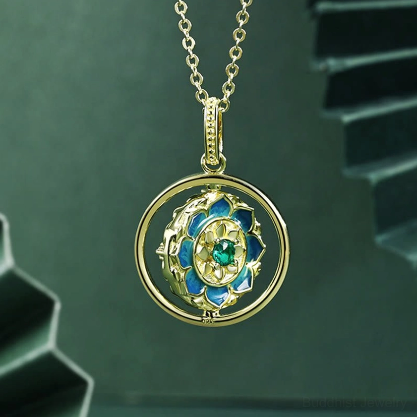 Dual-sided Buddhist pendant necklace showing back cross design with green geometric background
