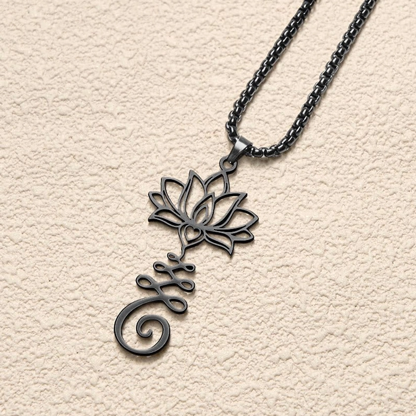 Gold stainless steel lotus enlightenment pendant on chain displayed flat lay showing hollow carved Buddhist symbol