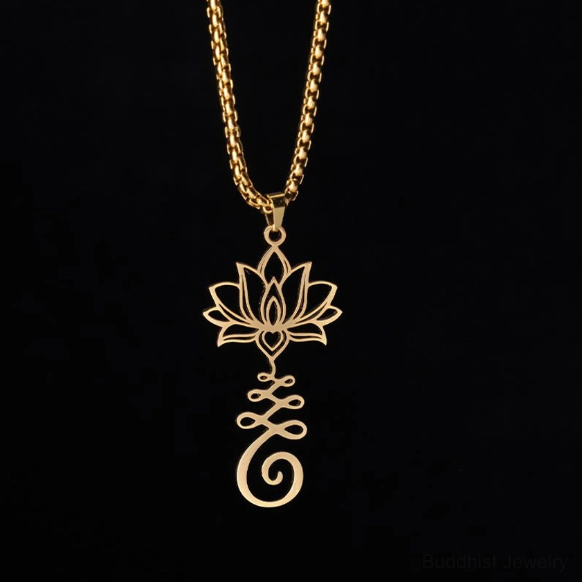 Gold stainless steel lotus spiritual pendant necklace hanging from chain on pure black studio background