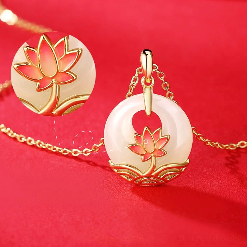 Side view close-up of jade lotus pendant necklace showing carved lotus detail and stone texture on red background