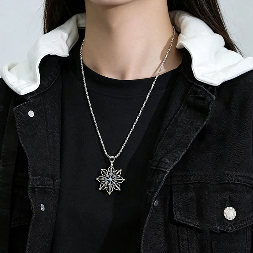 Buddhist lotus pendant necklace on model in street outfit, showing silver chain and detailed pendant styling