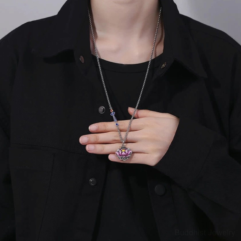 Lotus necklace worn on neck during daily casual wear, styled with black shirt showing comfortable everyday spiritual jewelry