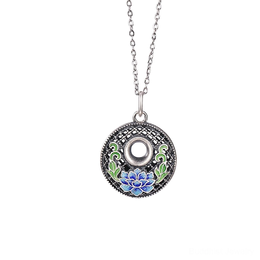 Silver lotus pendant necklace worn at neck with V-neck clothing delicate studio portrait view