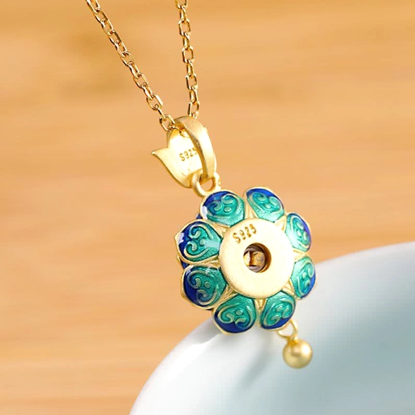 Back view of sterling silver prayer wheel pendant showing 925 hallmark, cloisonne enamel lotus petals, and hanging bead detail
