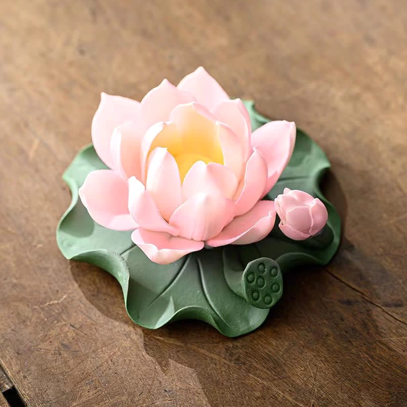 Light pink lotus ceramic incense burner with green leaf base and small lotus bud detail