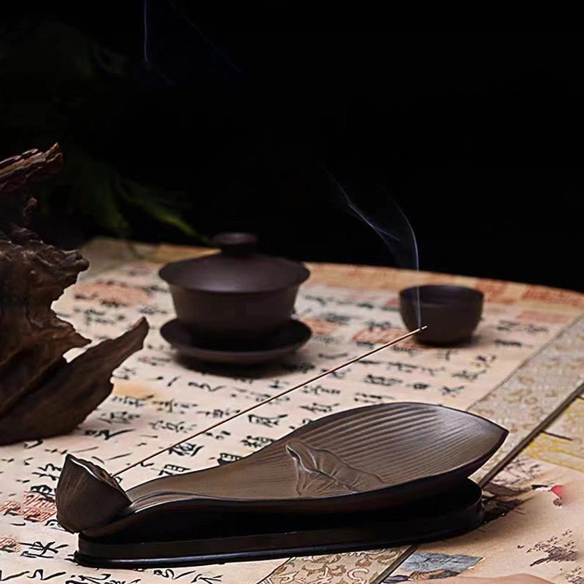 Handcrafted lotus pod incense burner detail showing artisan ceramic craftsmanship and lotus embossment