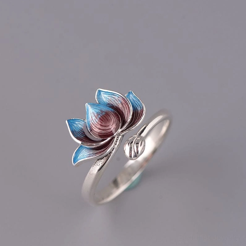 Adjustable lotus ring oblique angle showing open band design and enameled blue-brown lotus flower