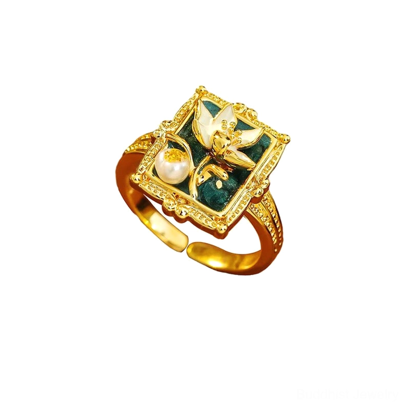 Detailed close-up of adjustable lotus ring - enamel lotus flower with pearl center and 14k gold-plated copper frame