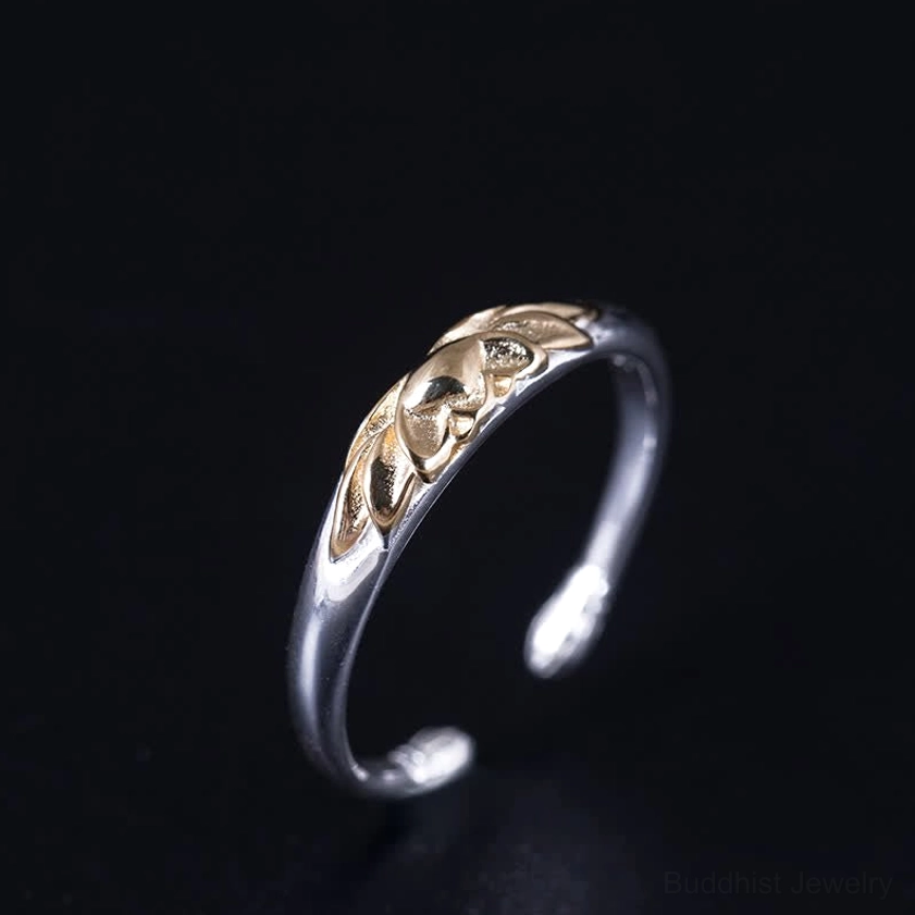 Two-tone sterling silver lotus cuff ring side profile showing adjustable open band design and gold lotus detail