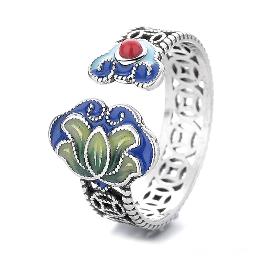 Top view of open lotus ring with large enamel lotus motif, hollow coin band and red bead accent
