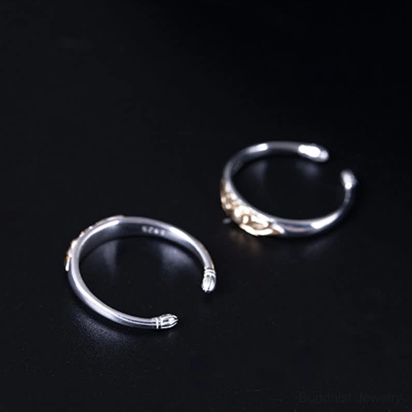 Two styles of sterling silver lotus open cuff rings showing gold lotus motif variant and lotus end caps design