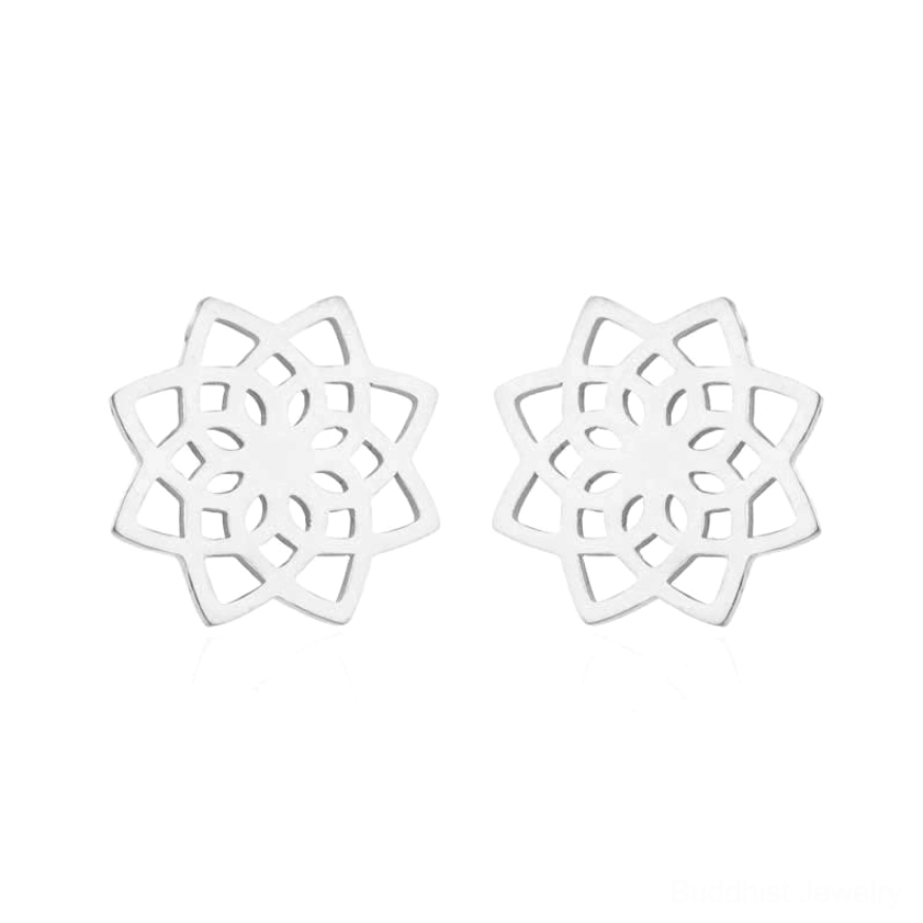 Pair of silver hollow lotus flower stud earrings in flat lay studio photography with polished metal finish