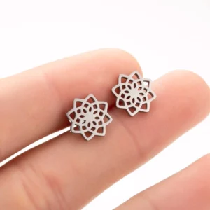 Silver lotus stud earrings held in fingertips showing 11mm diameter size and hollow floral cutout design