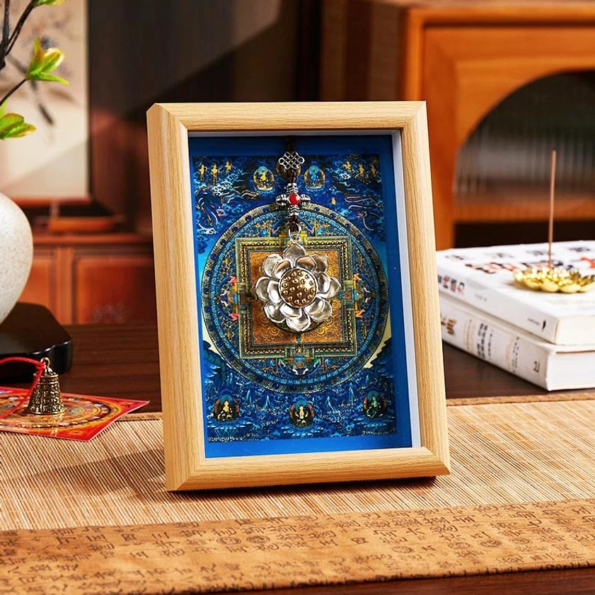 Sacred lotus thangka photo frame with blue mandala background in light wood finish displayed on Chinese-style tea table