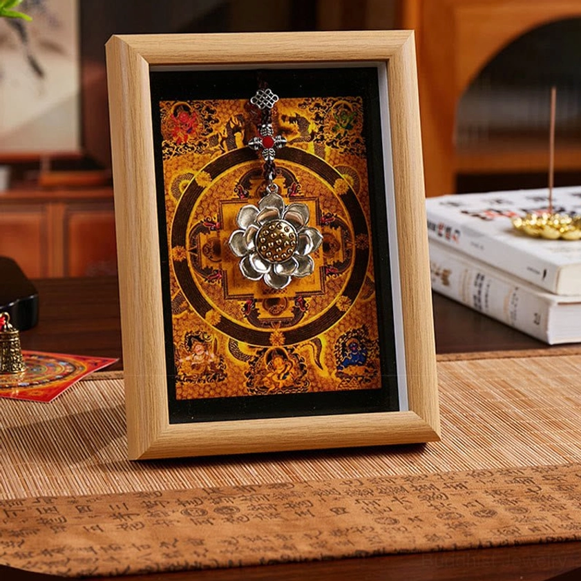 Sacred lotus mandala thangka photo frame with golden yellow design and light wood frame for meditation space