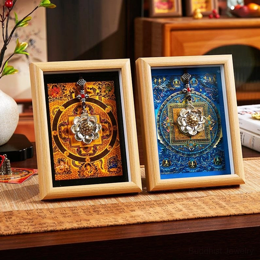 Pair of handcrafted lotus thangka frames with blue and yellow mandala designs on Chinese tea table setting