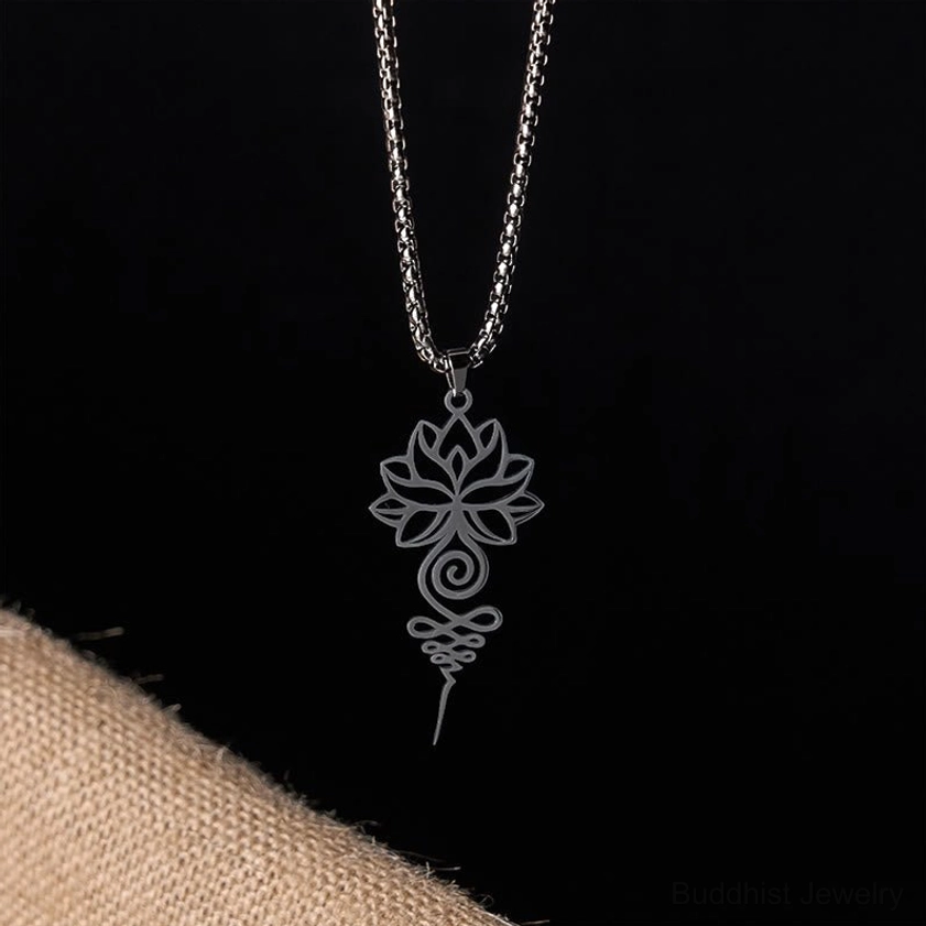 Lotus unalome spiritual necklace pendant displayed on neutral background highlighting hollow filigree craftsmanship