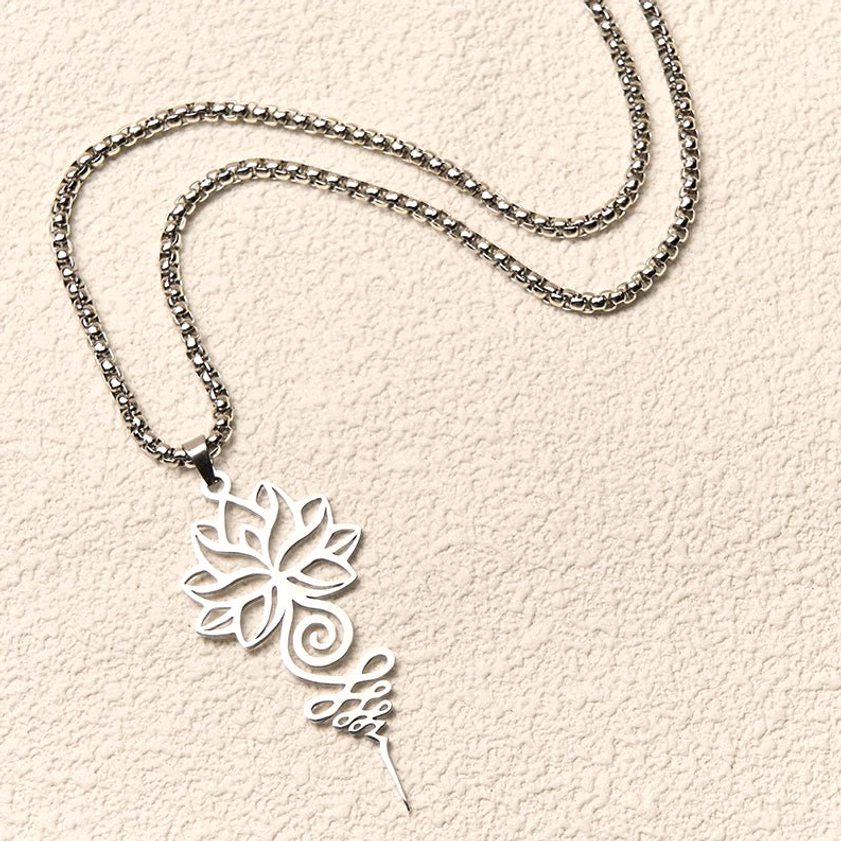 Flat-lay side view of silver lotus unalome necklace with box-link chain showing intricate hollow lotus and unalome spiral pattern