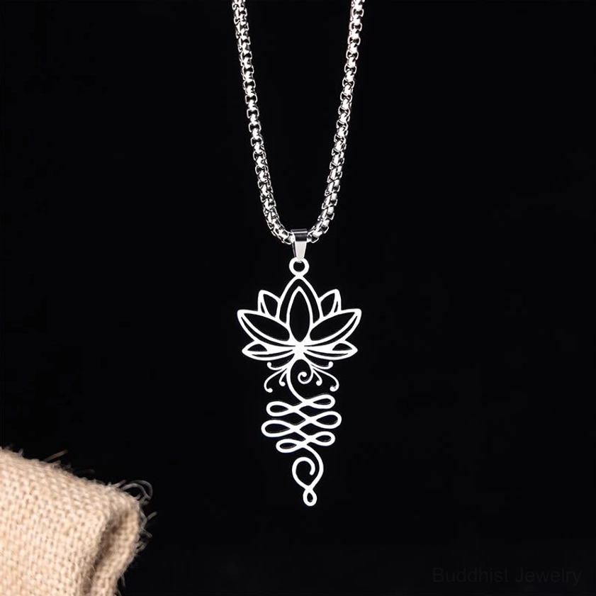 Lotus unalome Buddhist necklace pendant with box chain vertical close-up on black background