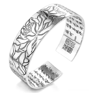 Handcrafted lotus white copper Buddhist open cuff bracelet with carved lotus pattern and sutra engravings, tilted 3/4 side view showing intricate details