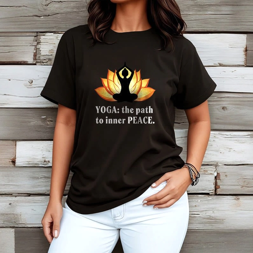 Female model wearing black lotus yoga t-shirt white pants wooden wall background styling