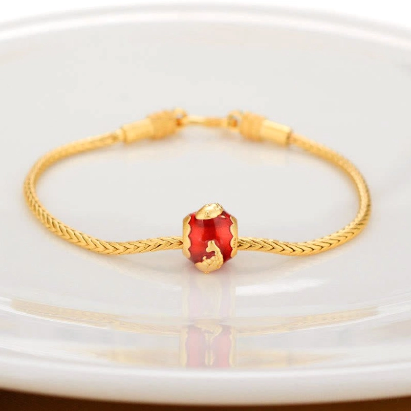 Buddhist bracelet with lucky koi fish enamel charm on gold twisted chain