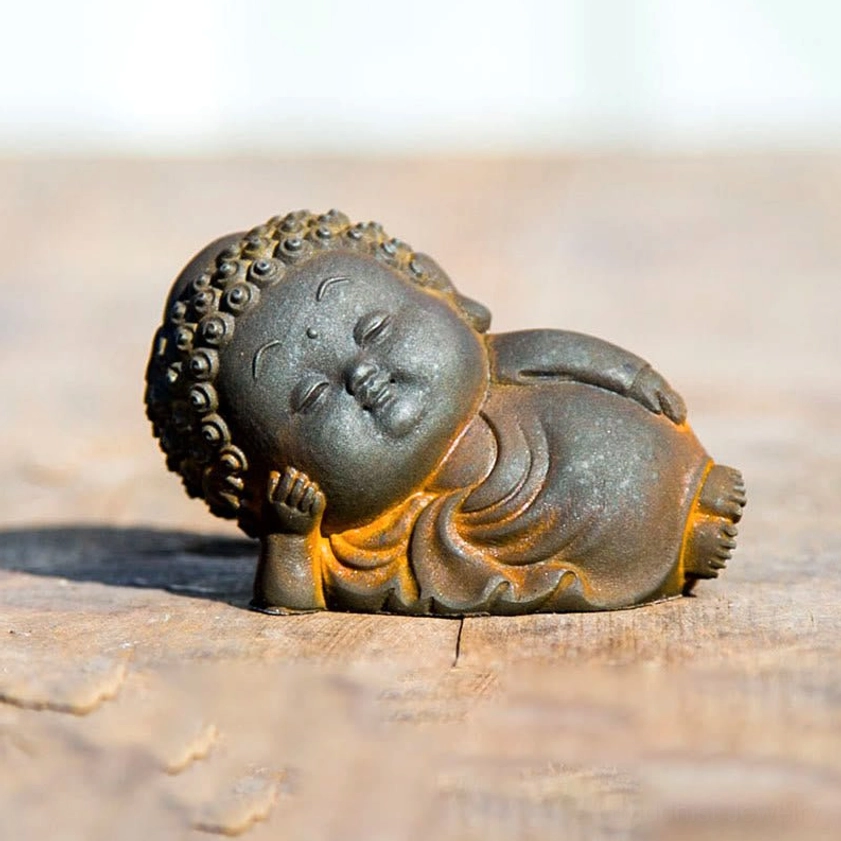 Lying reclining Buddha statue 5x8cm size showing complete side profile and peaceful posture