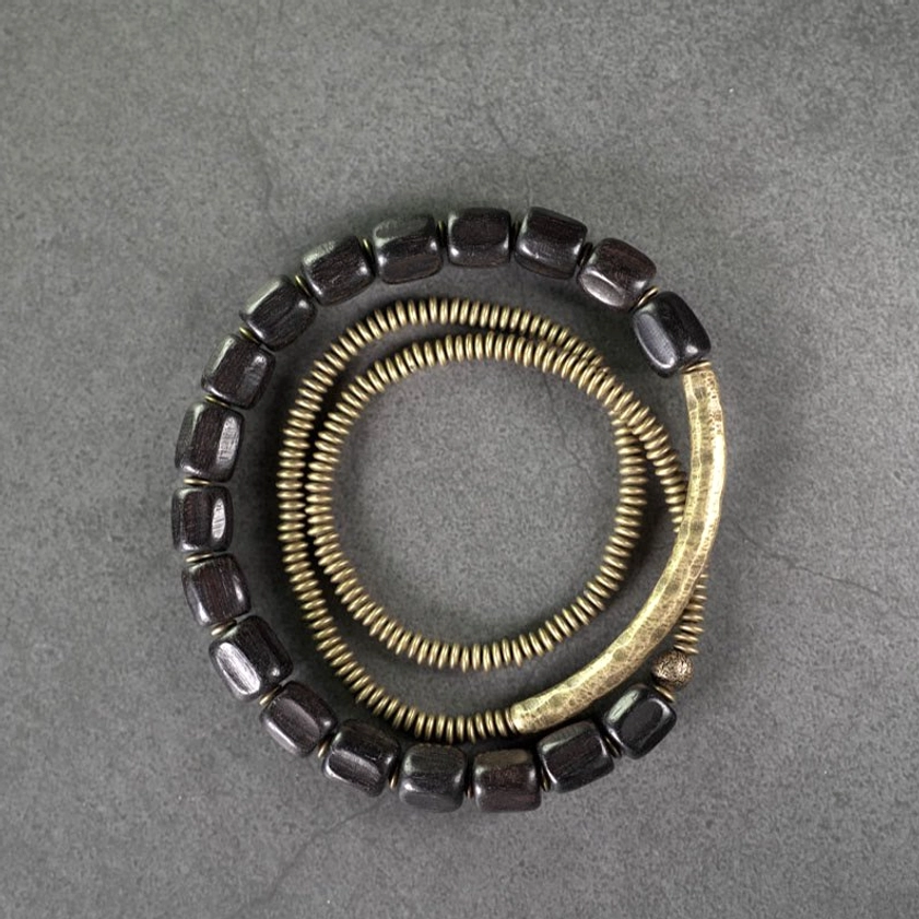 Macro view of individual beads - ebony wood cylinders and ridged copper spirals