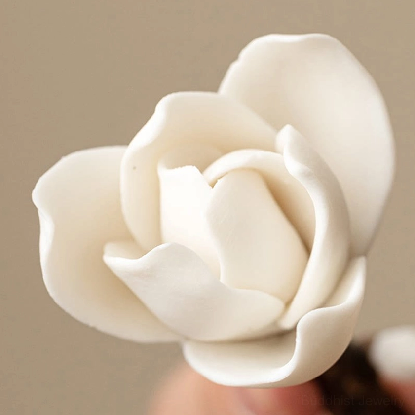 Detailed front close-up of ceramic magnolia incense holder showing lifelike layered white petals and authentic handcrafted ceramic texture