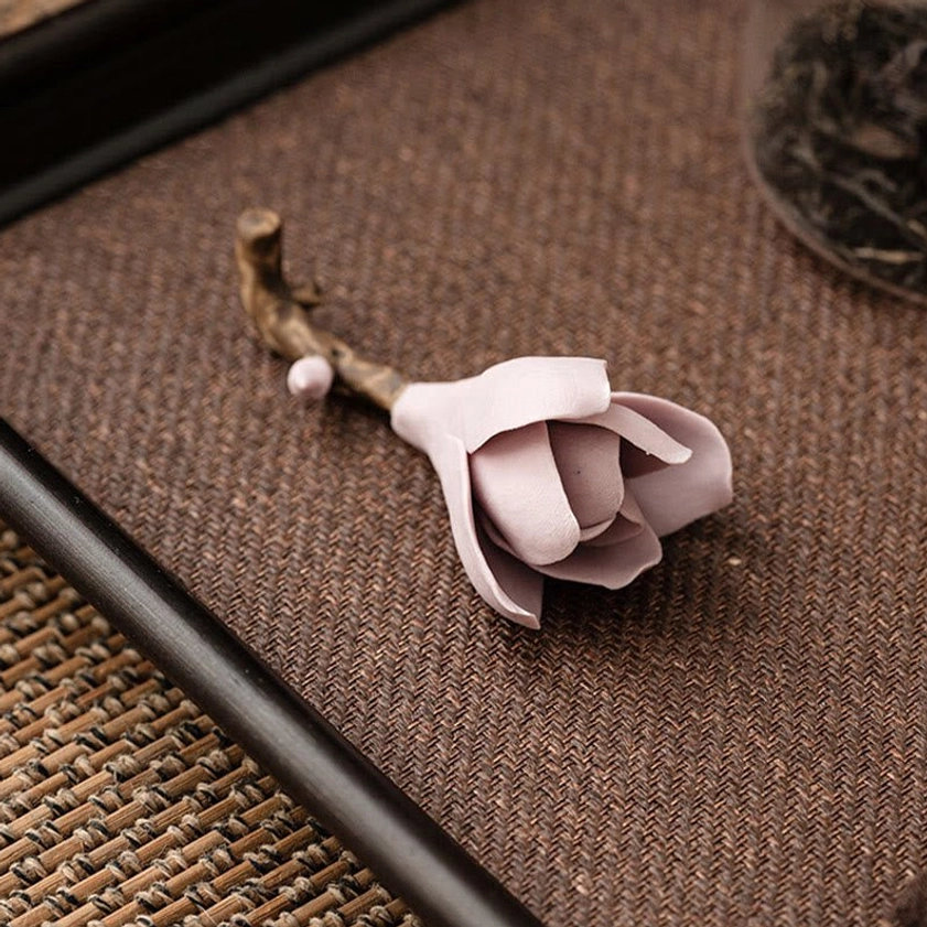 Ceramic magnolia incense burner detail showing Buddhist symbolism and artistic design of handcrafted petal work