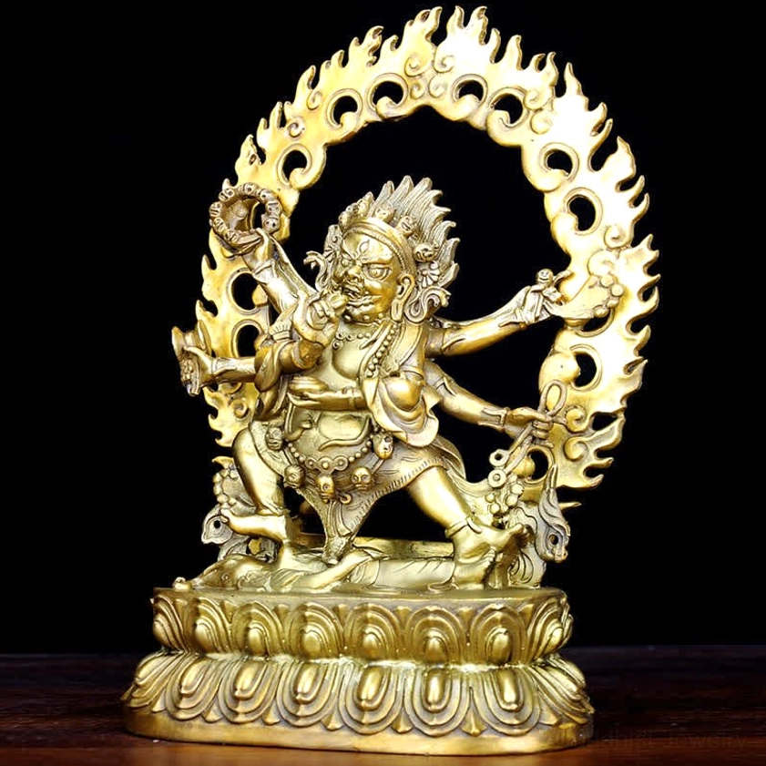 Three-quarter front view of handcrafted Mahakala copper deity statue showing intricate multi-armed design and fierce compassionate expression