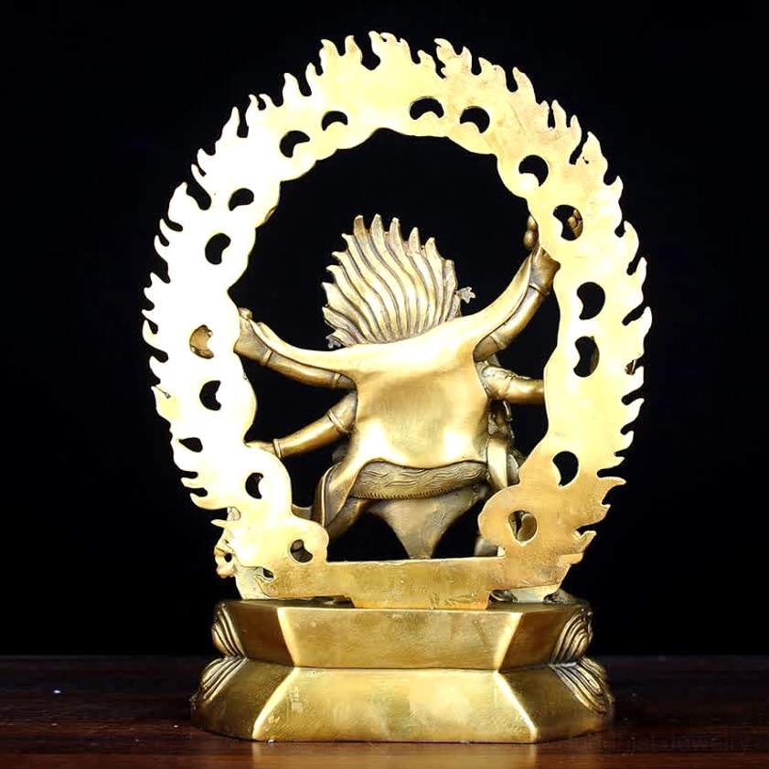 Rear view of Mahakala six-armed statue with hollowed flame aureole and stepped lotus pedestal detail