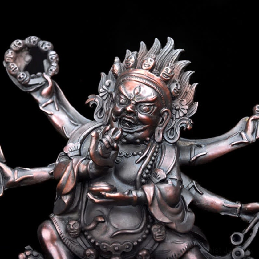 Artisanal handcrafted Mahakala six-armed Buddhist statue showcasing traditional copper work and spiritual artistry