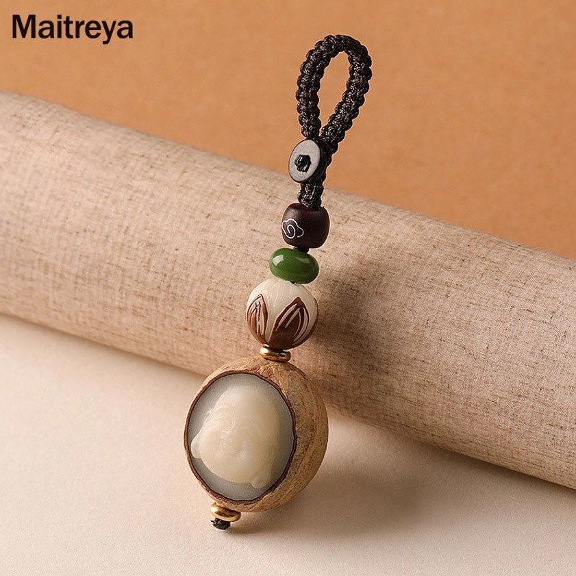 Maitreya Buddha bodhi seed keychain with carved Buddha face and consistent beaded design