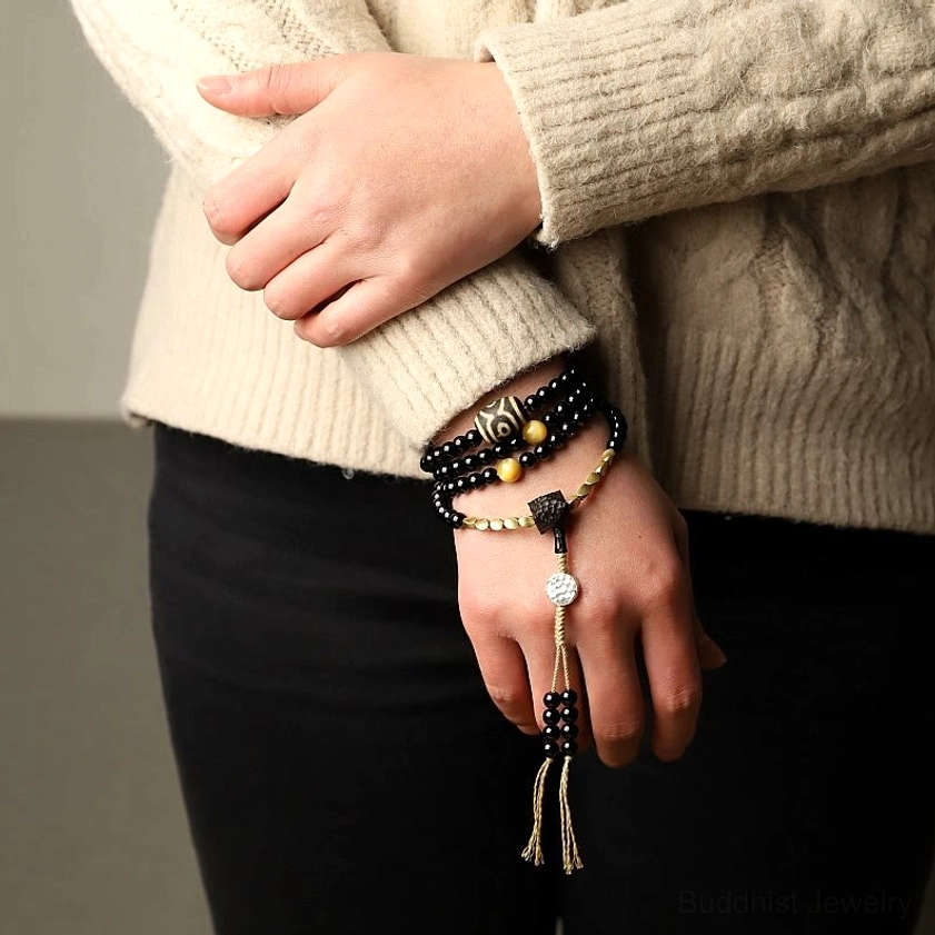 Mala beads bracelet six millimeter beads showing comfortable elastic fit on wrist