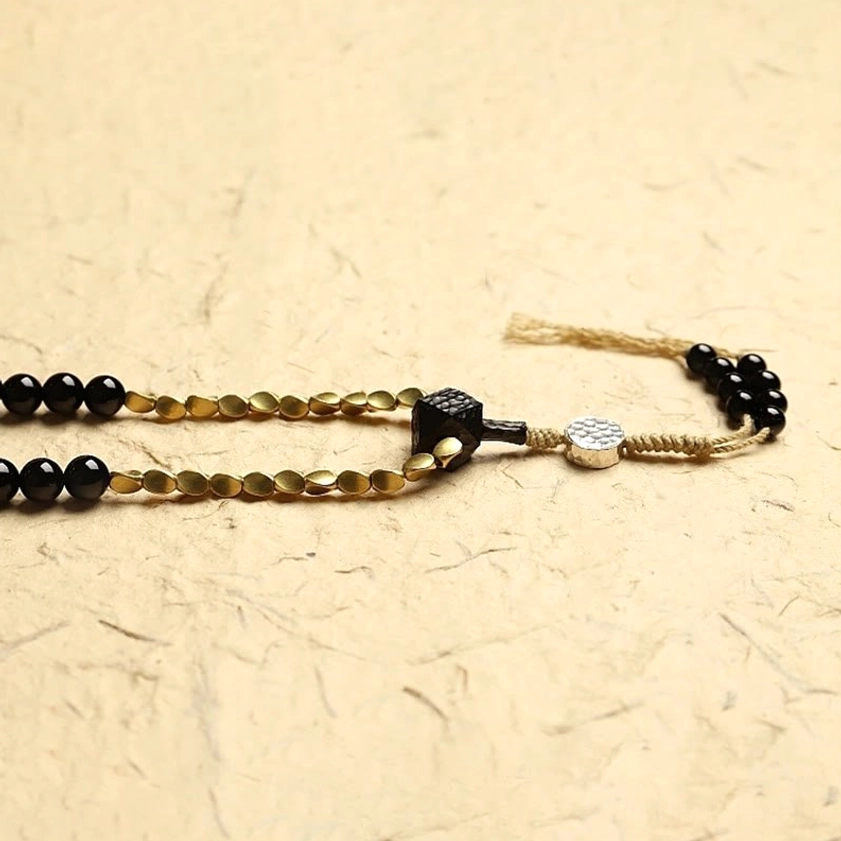 Mala bead closure and brass clasp component with black onyx and metal decorative elements