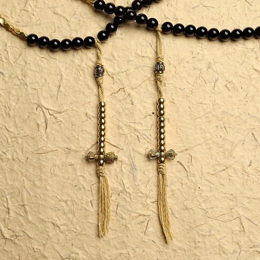 Handmade mala bead counter accessories featuring brass dorje spiritual symbol and tassels