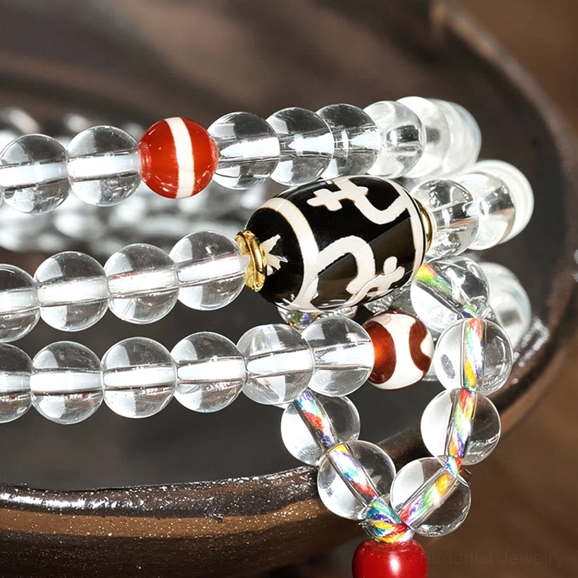 Crystal glass Buddhist mala beads with red and white striped accent beads detail