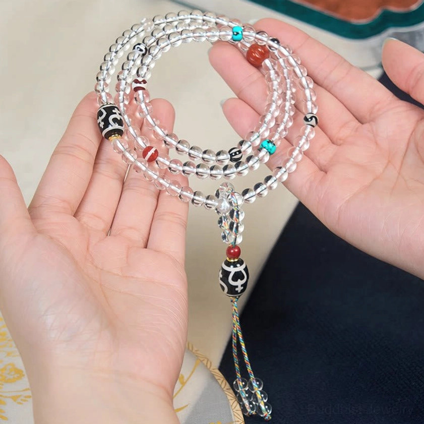 Hand-held Buddhist prayer mala with crystal beads and metal dzi tassel pendant