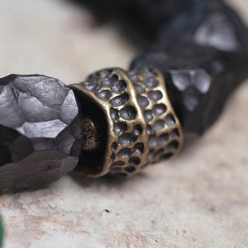 Intricate carved bronze copper spacer with faceted ebony wood beads - Buddhist mala craftsmanship
