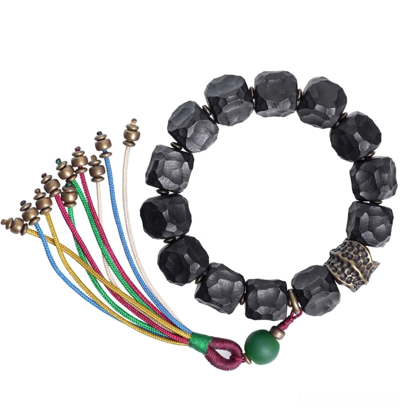 Handmade natural materials used in Buddhist mala bracelet - ebony wood and copper