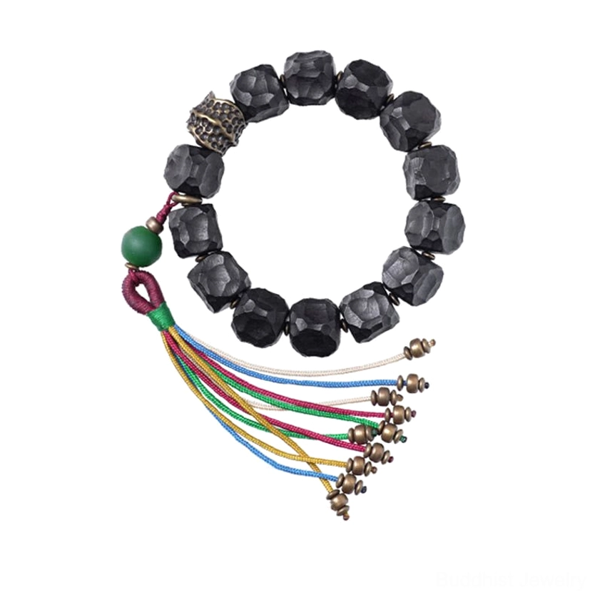 Spiritual benefits of ebony wood and copper in Buddhist mala bracelet practice