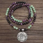 108 mala necklace with amethyst green aventurine beads and engraved silver lotus charm pendant, long meditation prayer necklace flat lay