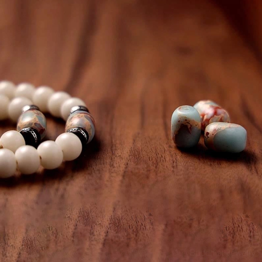 Partial Buddhist prayer mala strand with patterned Dzi spacer beads and natural colored stone beads, meditation jewelry