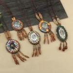 Collection of handcrafted mandala beaded pendant necklaces in various styles showing colorful mosaic designs and brown leather cords
