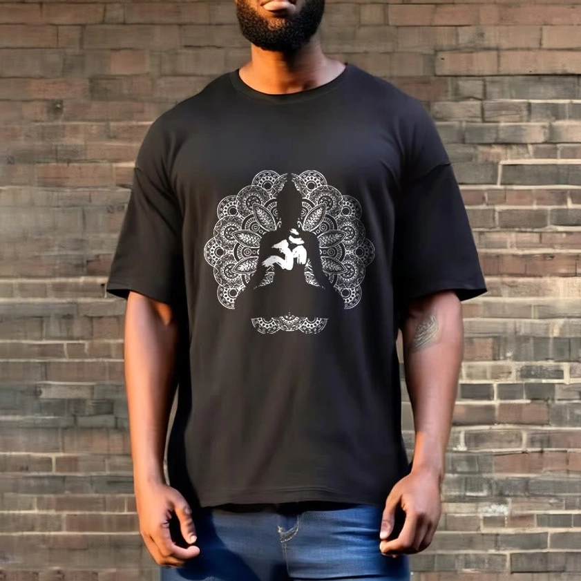 Man wearing black mandala om buddhist graphic t-shirt full body outdoor brick wall